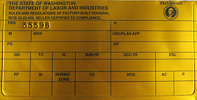 Metallic gold label issued by L&I that signifies compliance with rules and regulations for factory-built housing.