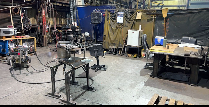 Photo shows microwave and the refrigerator used to store the employees’ food or drinks located in their welding area. The employees take all their breaks and lunches in their work areas where they may be exposed to toxic substances.