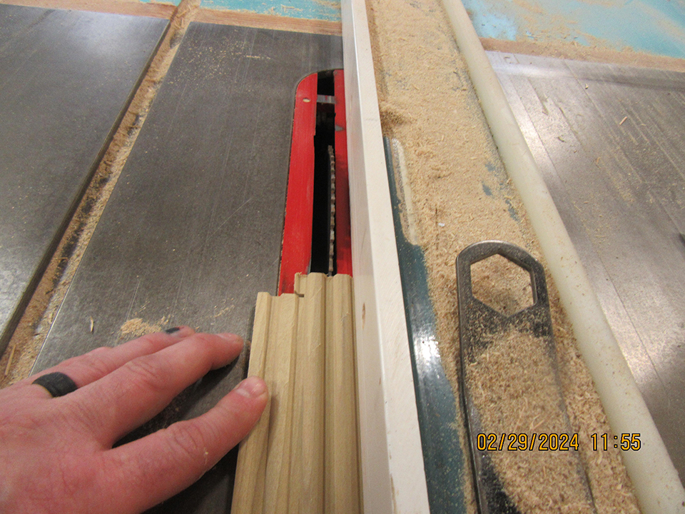 Table saw without safety guard installed.   